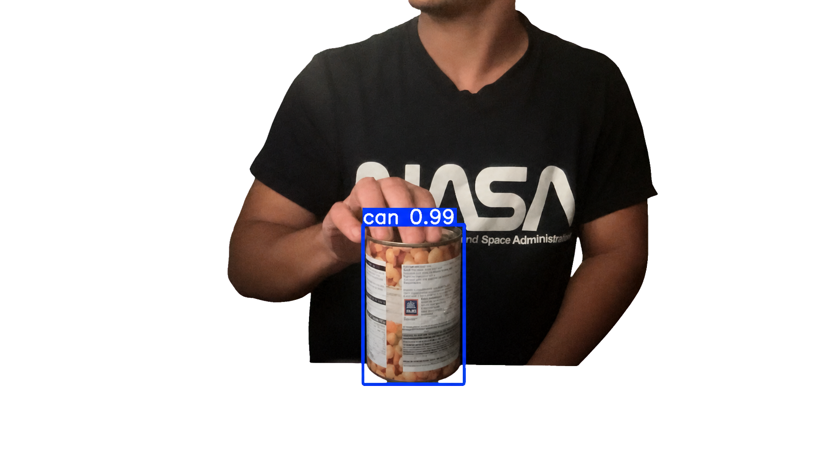 Person holding a tin can detected with a confidence score of 0.99